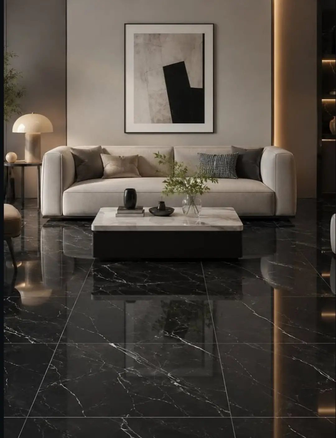 Polished black marble tiles with white veining covering a modern living room floor.