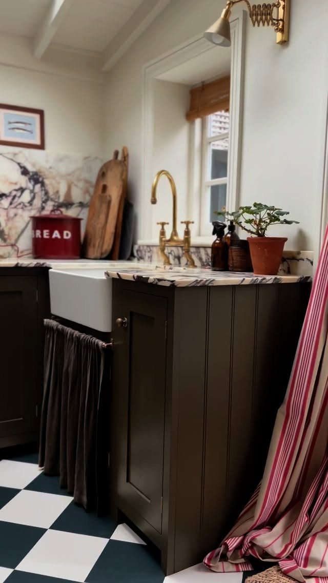 Kitchen Floor Tiles Design: 13 Ideas for Stone, Ceramic & Patterned Floors 2 Black and white checkerboard tiles on a kitchen floor next to dark wood cabinetry.
