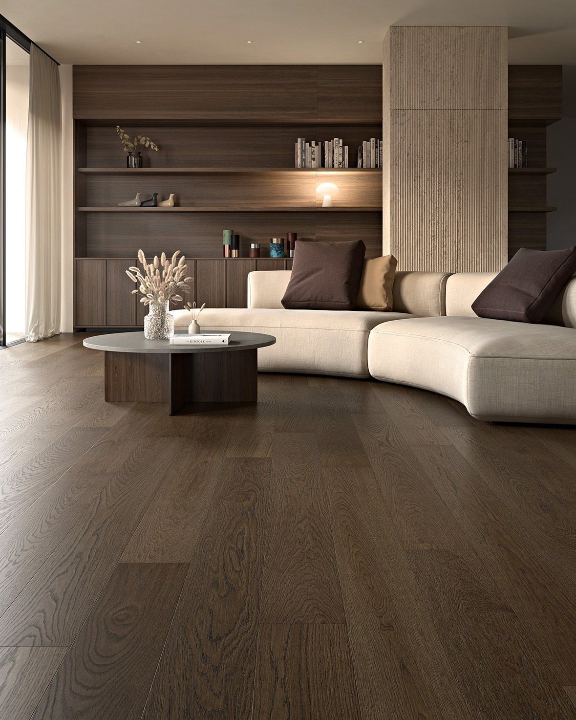 Dark brown wood plank flooring in a modern living room with a cream sofa.